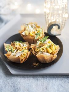 Baskets of phyllo dough with penne amberjack and bottarga