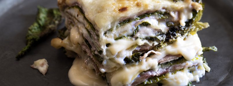 Cabbage lasagna with cooked ham, fontina cheese and bechamel