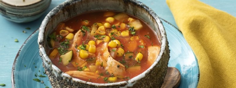 Corn soup with tomato and chicken breast