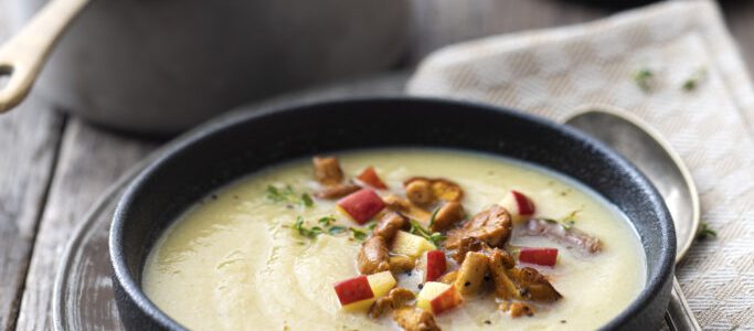 Cream of onion and celeriac soup with chanterelles