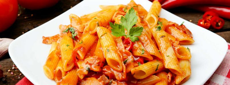Penne all'arrabbiata with spicy chilli pepper, the tradition of Lazio on the plate