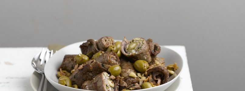 Rolls of green olives and veal, almonds and ham